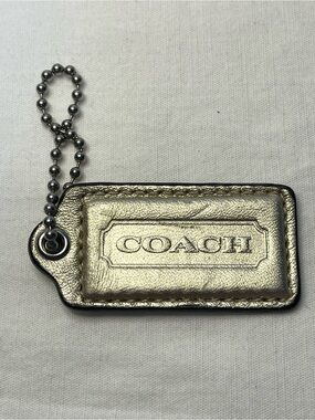 COACH Metallic Gold Leather Hang Tag with Ball Chain